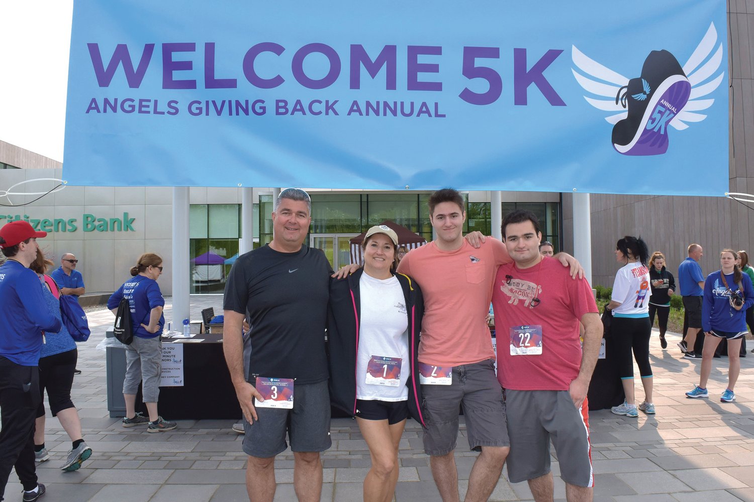 FAMILY BUSINESS: From left to right, Andy Delli Carpini, CEO, Sandy Delli Carpini, Owner/Chief Marketing Officer (CMO), and their children Michael and Nicholas Delli Carpini, pose for a family photo at the inaugural Angels Giving Back 5k event in 2019.